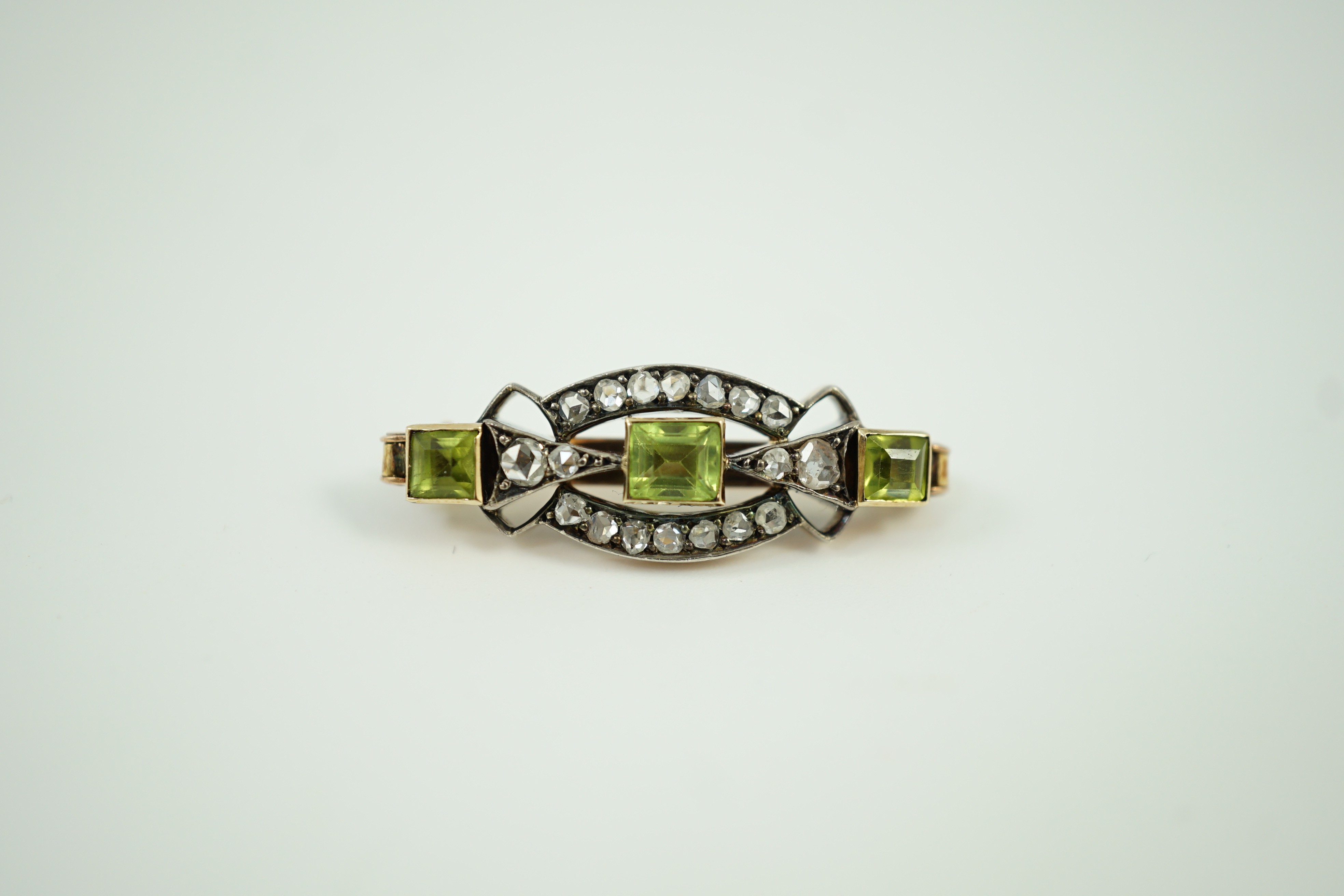 A late Victorian yellow metal, peridot and rose cut diamond set brooch, 31mm, gross weight 4.9 grams.